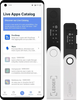the Ledger Live Apps catalog on a mobile device and the Nano S Plus